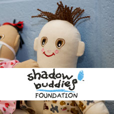Shadow Buddy doll with logo