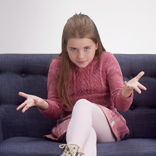 Girl sitting on blue couch