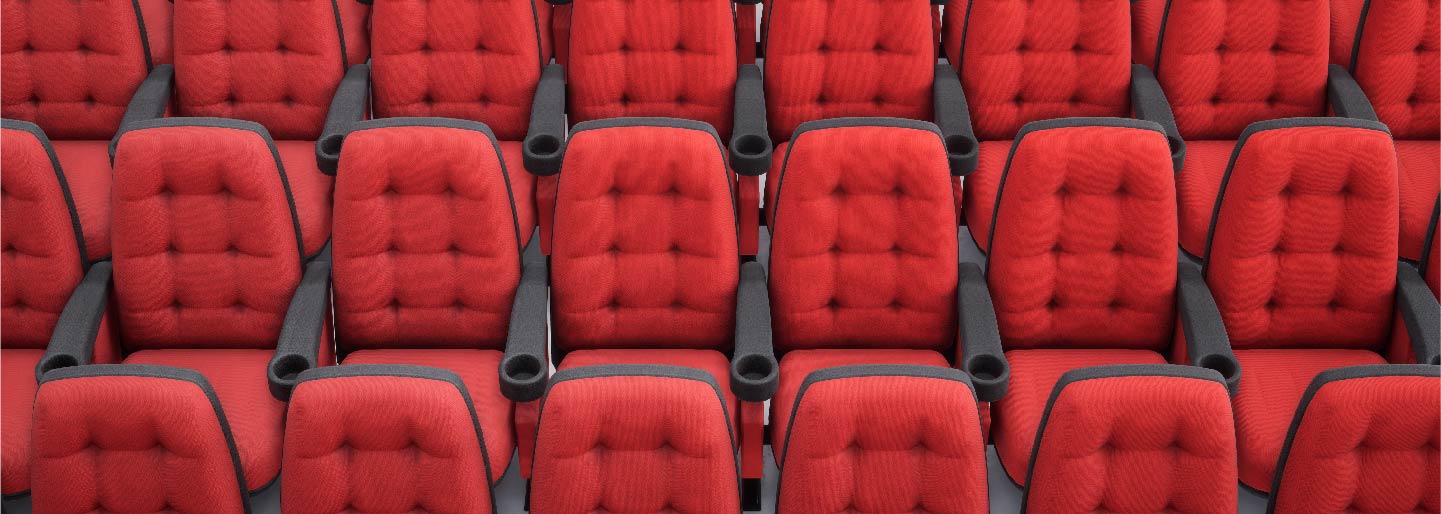 Red empty chairs in theater