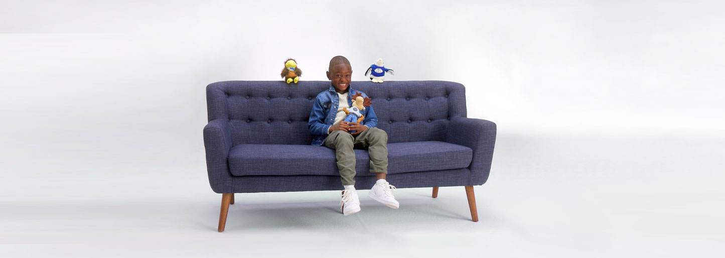 Kids sitting on blue couch