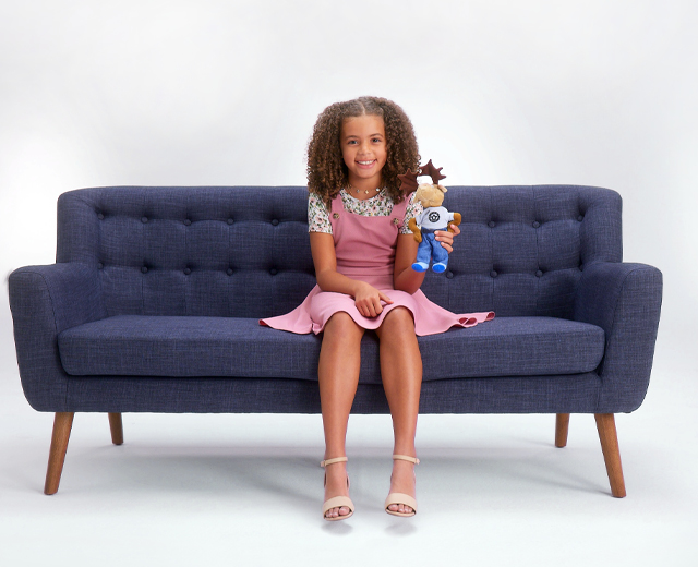 Girl sitting on blue couch