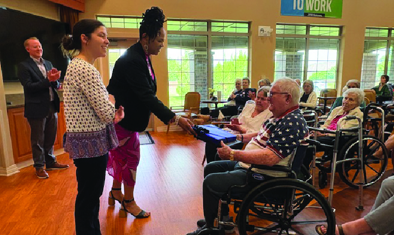 Regent Park Assisted Living and Rehab flag presentation.