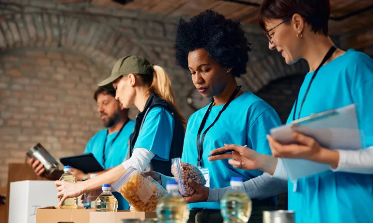 Employees volunteering at a food kitchen. 
