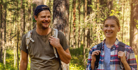Man and woman hiking in the forest