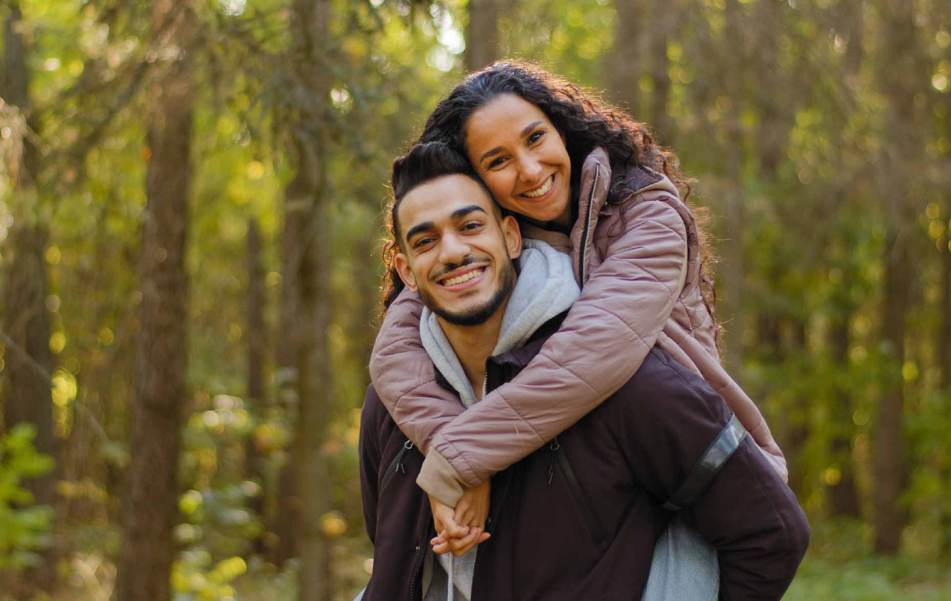 Man and woman hugging and smiling