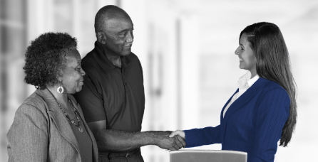 Portfolio manager shaking client's hands.