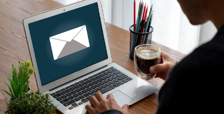 Email icon on laptop.