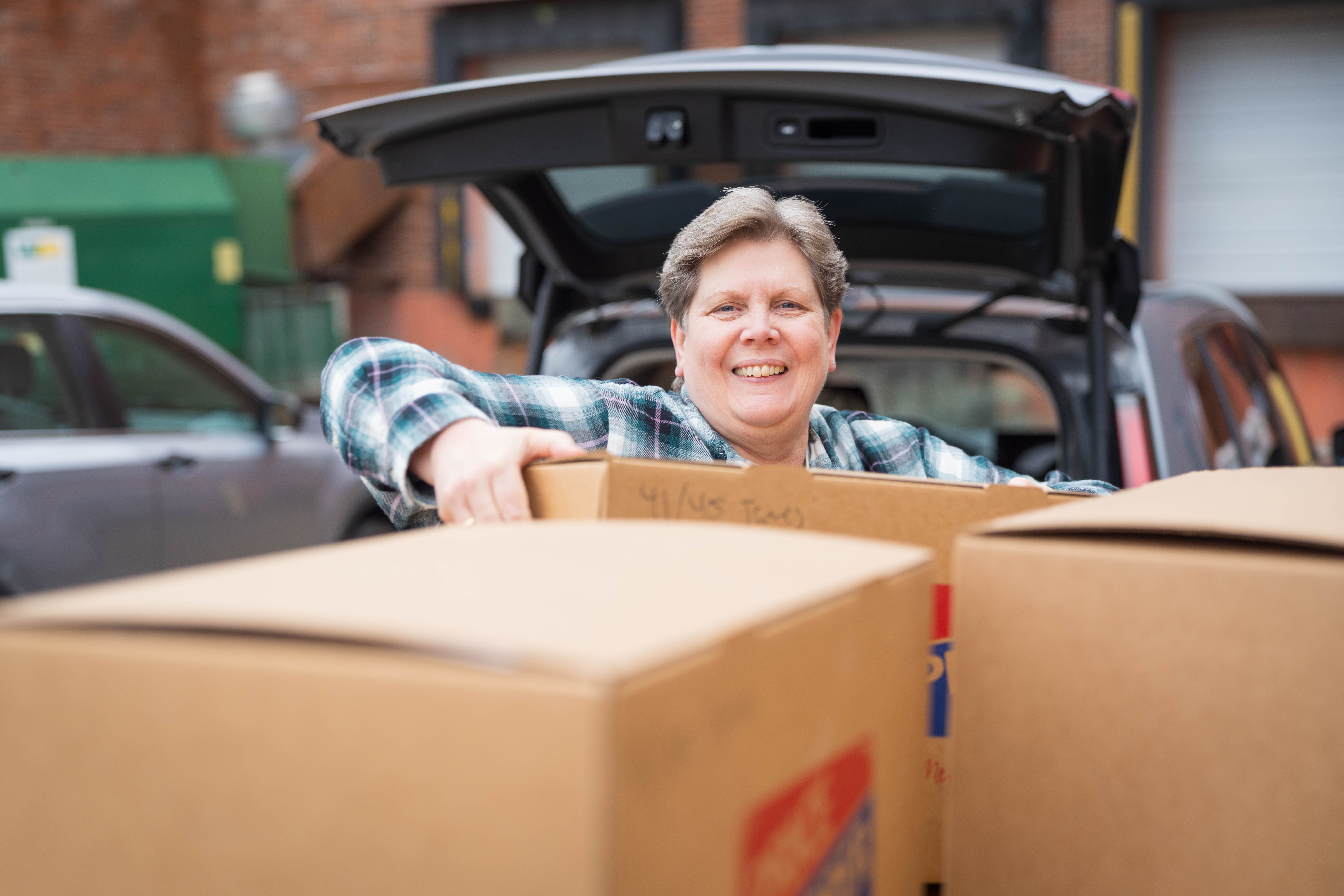 Woman-picking-up-box.jpg Woman-picking-up-box