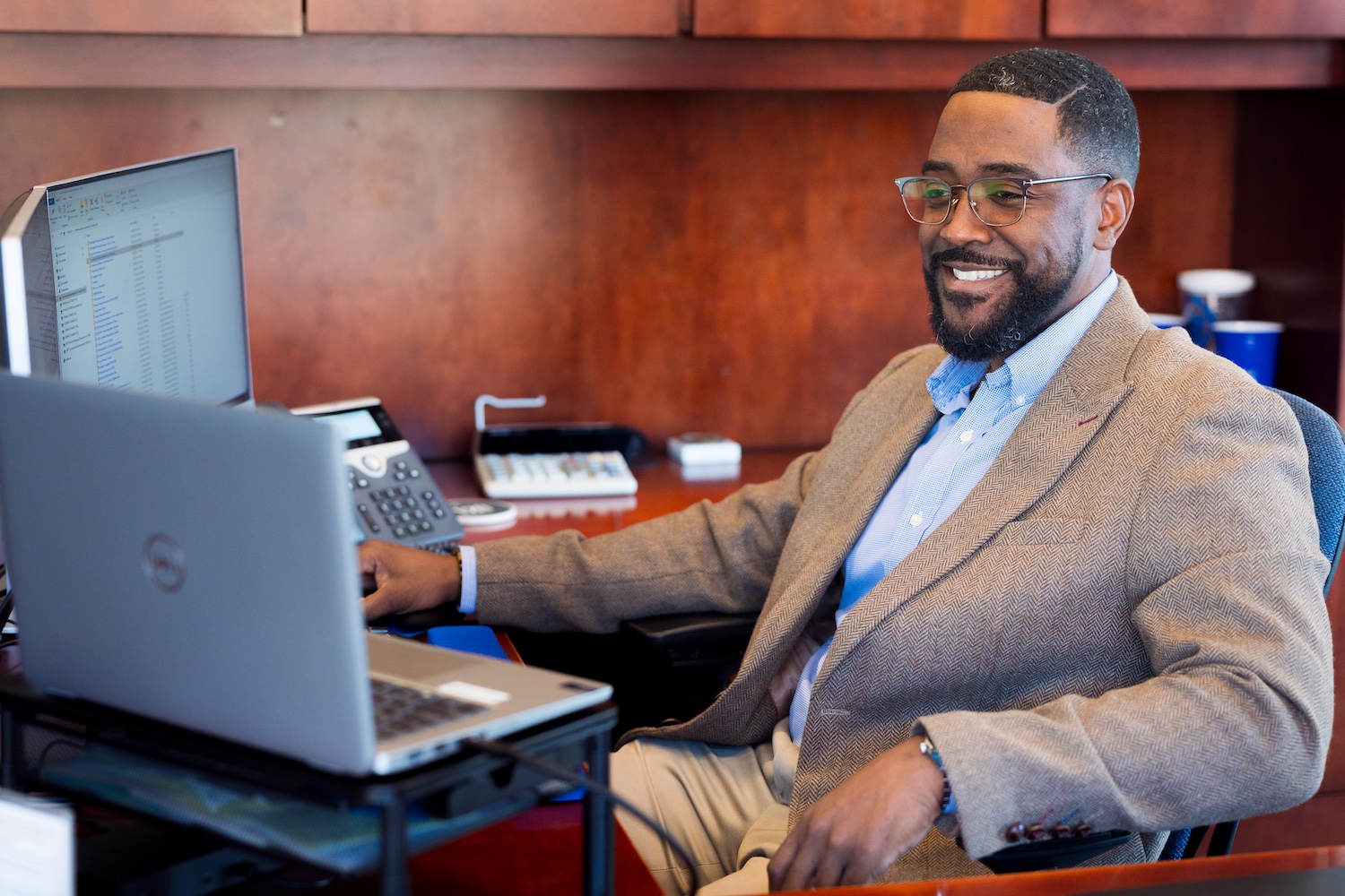 Lloyd-Rainge-sitting-at-desk.jpg Lloyd-Rainge-sitting-at-desk