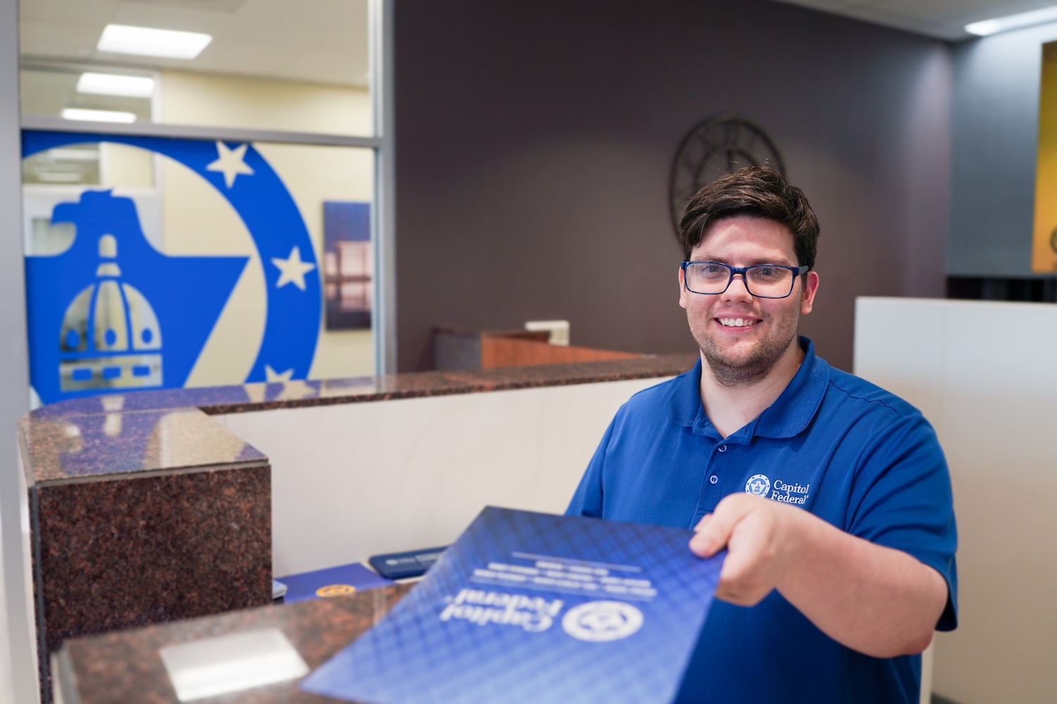 Cody-Bell-holding-folder.jpg Cody-Bell-holding-folder